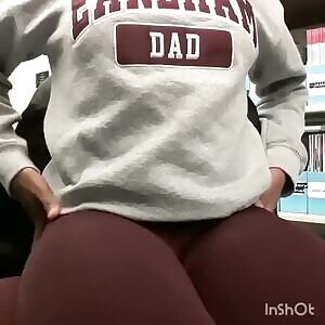 Quakers' fan showing off in library