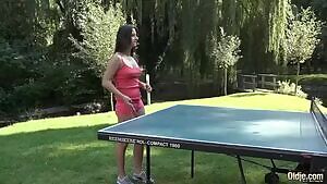 Enjoying a game of outdoor table tennis