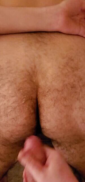 Cumming all over a cute fuzzy bottom