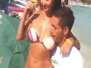 Happy embarrassed girl on the beach