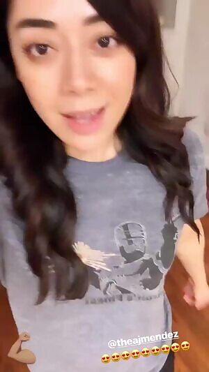 AJ Lee being shy about her amazing abs.