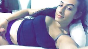 A cute tgirl stroking in bed