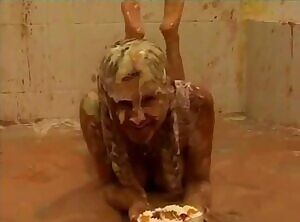 Rubbing some dessert in her own face