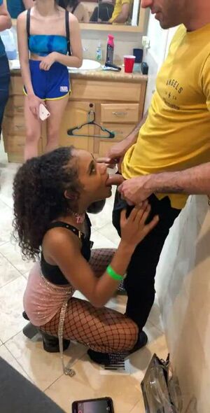 Scarlit Scandal sucking white dick in front of others