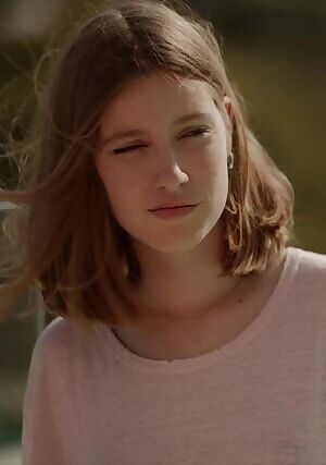 Stripping off her shirt and getting wet