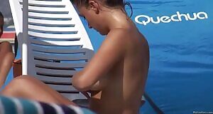 Applying Her Suntan Lotion