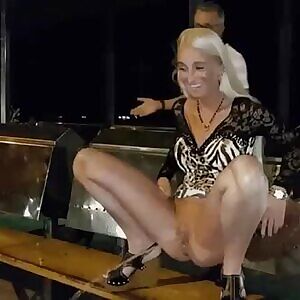 Woman pees off bench and get caught by a man. Anyone know what video this comes from? And who the girl is?