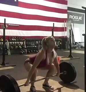 Girl has trouble lifting weights around her massive Tits