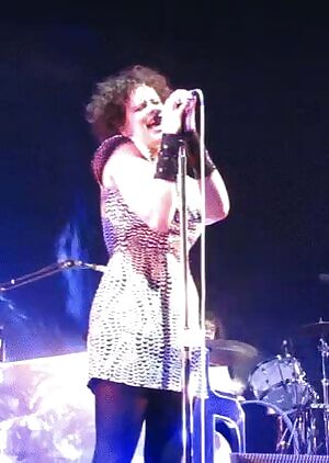 Sexually alluring Régine Chassagne is aware of the entire male crowd wanting to go up on stage & wildly bang her. Having a several hours long wild intense gangbang with her.
