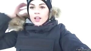 making herself comfortable in a ski lift