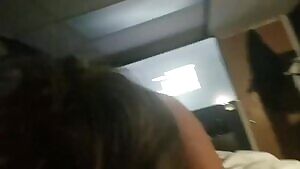 Asian diligently sucks while he watches TV