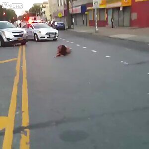 Naked woman in Bronx rolling around in the street