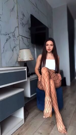 Crossed Legs Brunette Fishnet