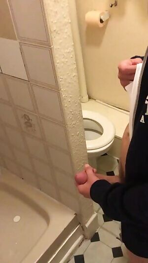 Jerks off his massive pissing cock while his buddy films