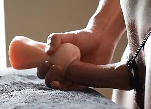 The poor toy is spread wide by my thick cock