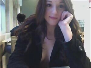 Busty brunette gets topless in the library