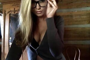 Cleaning her glasses