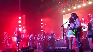 Flashing her big tits at a concert