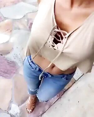 43yo Stacy Sanches walks and shows her hard bolted on tits and flat belly GIF