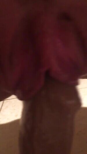 wife stretching her labia on her thick dildo