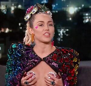 Miley showing off her perky little tits.