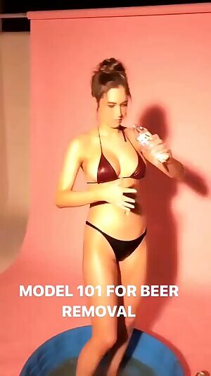 Elsie Hewitt trying to clean up in a black bikini