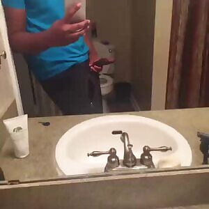 Casually leaning against the wall