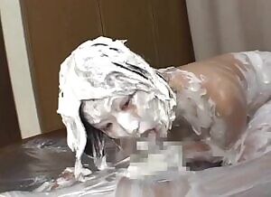 Horny Japanese couple have sex in thick whipped cream