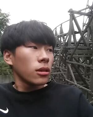 Asian dude gets his dick sucked off on a carnival ride.