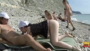 Nudists having sex at the beach
