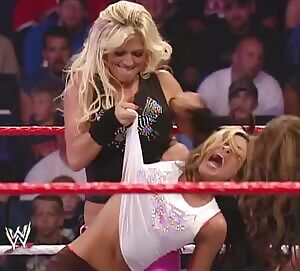 Melina's Top Pulled Off By Torrie