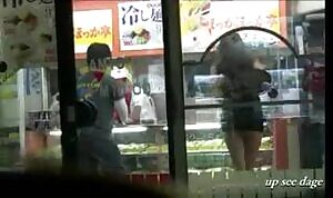 Flashing her ass to people in the store