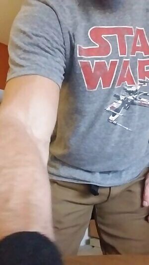 Stripping in front of a bay window in the front room