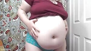 Playing her belly
