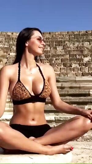 Readjusting her top