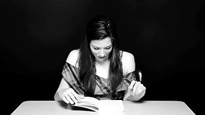 Stoya being driven to orgasm by a vibrator while trying to read a book