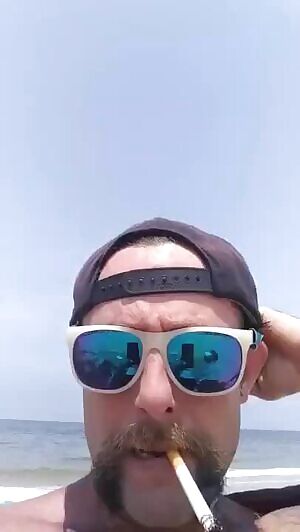 Milf gets super wet touching her hairy pussy at the public beach