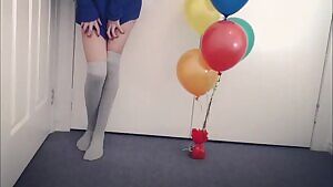 The perfect birthday gift: balloons, and a suction dildo that hits the spot.