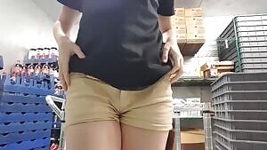 Pizza delivery girl showing off the goods