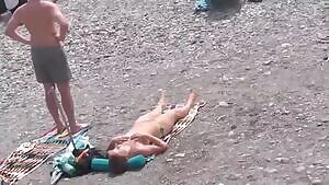 Annoyed to be Topless on the Beach