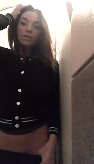 Cutie in an airplane bathroom