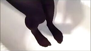 Wetting in her black pantyhose