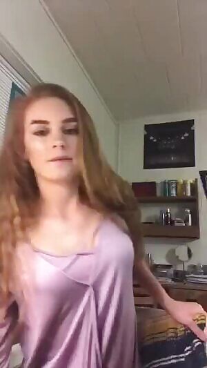 showing pierced nipples