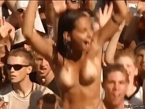 Cute topless girl in crowd at Woodstock 99
