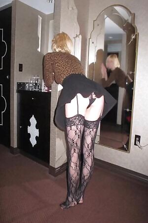 Me bending over in a short skirt in a hotel room