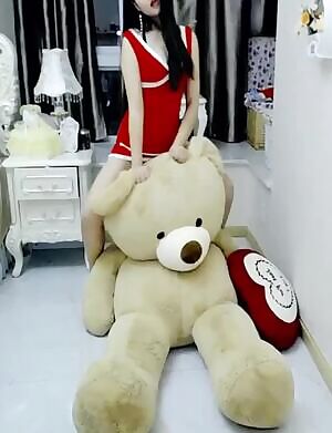 Humping her Big Teddy Bear