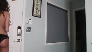 Getting her pizza order while topless