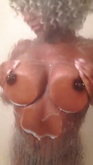 Soapy titts against the glass