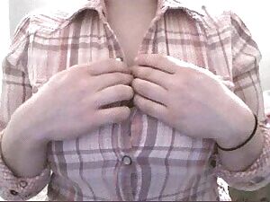 Unbuttoning her shirt at you