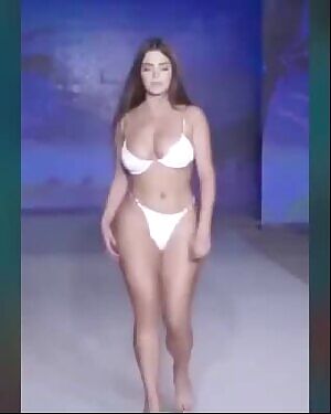 She can barely carry that thing